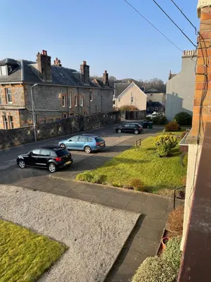 a group of cars parked in a parking lot at Dalriach Apartment in Oban