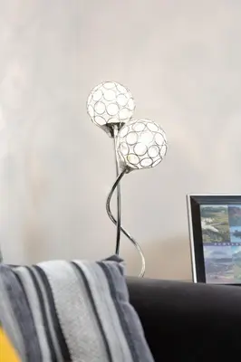 a metal lamp sitting on top of a couch at Bothwell Court Apartments in Dunfermline