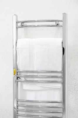 a metal towel rack hanging on a wall at Bothwell Court Apartments in Dunfermline