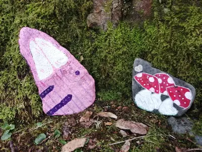 two stuffed animals sitting on the grass next to a tree at Nest Holiday Home Central Callander, Trossachs Self-catering in Callander