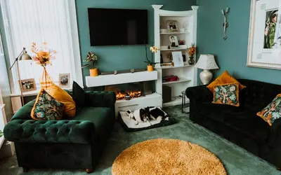 a living room with two couches and a fireplace at Dawn Break Guest House in Largs