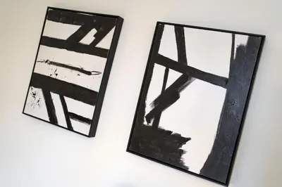 two framed mirrors hanging on a wall at Cross Road Apartment in Paisley