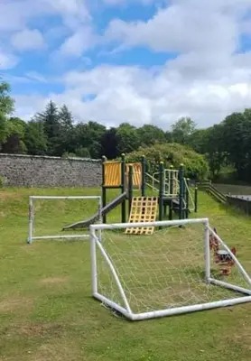 a childrens playground with a goal at The Rabbit Hill Holiday Home in Ballantrae