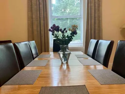 a vase of flowers sitting on top of a table at Allerton - Victorian Character Home in Stirling in Stirling