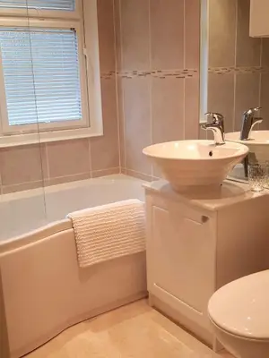 a bathroom with a sink and a tub and a toilet at Willow Lodge Auchterarder in Auchterarder