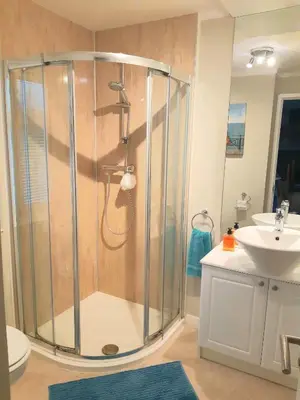 a bathroom with a shower and a sink at Willow Lodge Auchterarder in Auchterarder