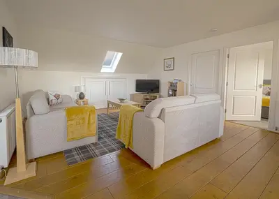a living room with two couches and a television at Castle View - Home from Home in Stirling