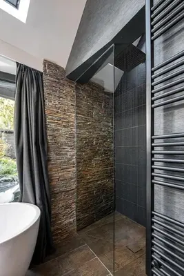 a bathroom with a tub and a sink and a shower at Roselea Cottage in Luss