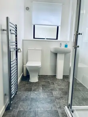 a bathroom with a toilet and a sink at Modern 2 Bedroom Apartment With Free Parking in Glasgow