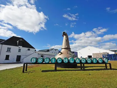 a statue of a space shuttle sitting in the grass at Burnside Cottage in Bruichladdich