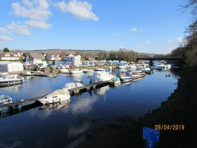 a group of boats are docked in a marina at Levenside Holiday Apartment, Balloch, Loch Lomond in Balloch
