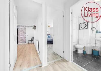 a white bathroom with a toilet and a sink at Berwick Apartment by Klass Living Coatbridge in Coatbridge