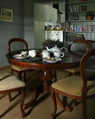 a dining room table with a tea set on it at Stormont House in Keilour