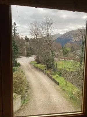 a view from a window of a dirt road at Springbank Apartment - Sleeps 4 - Pet Friendly in Fort William