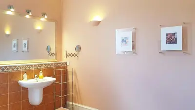 a bathroom with a sink and a mirror at Stylish Central Edinburgh Apartment in Edinburgh