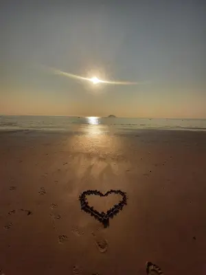 a heart drawn in the sand on the beach at Stunning Riverside Town House with views Ayrshire in Girvan