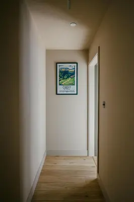 an empty room with a picture on the wall at The Church Tower in Crieff