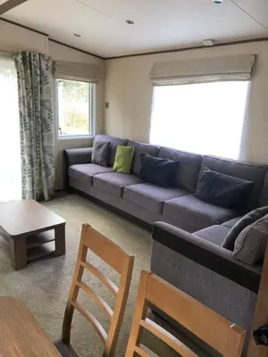 a living room with a couch and a table at River View 46 in Dunoon