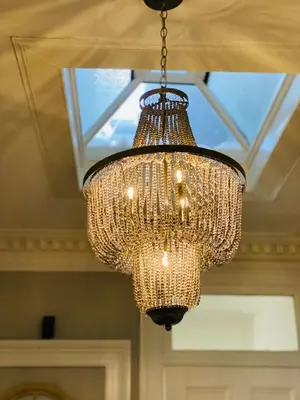 a chandelier hanging from a ceiling in a room at Upper Villa, Tighnabruiach, Argyll & Bute in Tighnabruaich