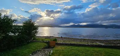 a view of a large body of water with mountains at The Old Ferryhouse in Port Appin
