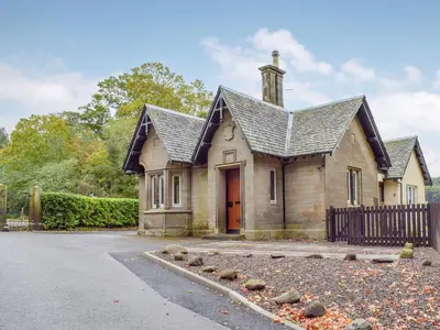 an old house with a black roof at The Lodge in Linlithgow
