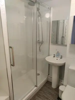 a bathroom with a shower and a sink at Station View in Oban
