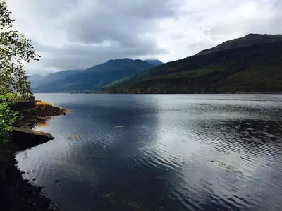 a large body of water with mountains in the background at Viking Cottage in Arrochar