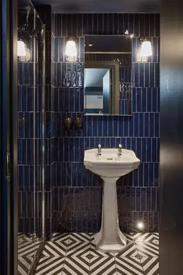 a bathroom with a sink and a mirror at No17 The Promenade in Oban
