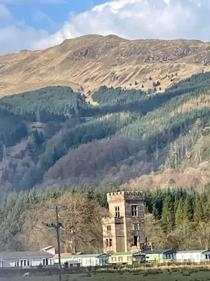 an old building in the middle of a mountain at Swift Bordeaux 73 in Dunoon