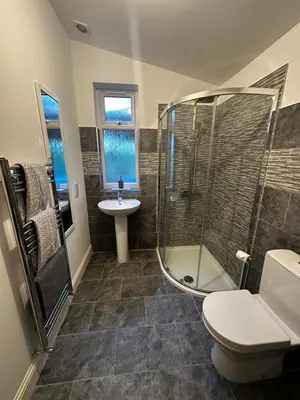 a bathroom with a shower and a sink at The Buckie at Buchanan - Drymen Holiday Home Sleeps 8 in Drymen