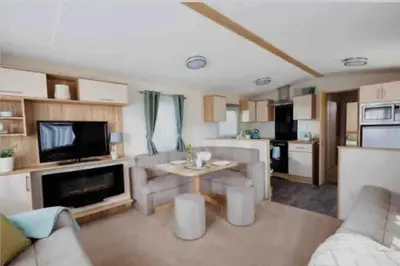 a living room with a couch and a table at AJL Caravan Rentals in Turnberry
