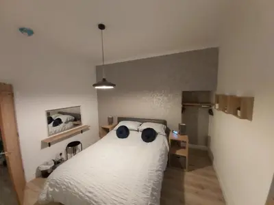 a bedroom with a bed with sunglasses on it at One bedroom flat, very close to Town center. in Oban