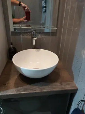 a white bowl sink on a counter in a bathroom at One bedroom flat, very close to Town center. in Oban