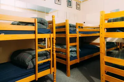 a group of bunk beds in a room at Belford Hostel in Edinburgh