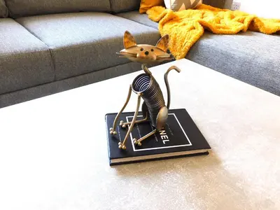 a figurine of a cat on a box on the floor at Newly refurbished 1 bed Apt in Hamilton Close to station and local amenities in Hamilton