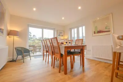 a dining room with a table and chairs at Blackmount House in Oban