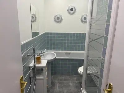 a bathroom with a sink and a toilet at Heart of George Street 2 in Oban