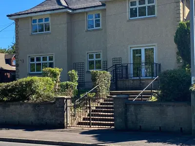 a house with stairs in front of it at The Dwelling Place in Irvine