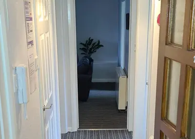 a hallway with a potted plant in a room at Beautiful 2-Bed Apartment in Campbeltown in Campbeltown