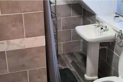 a bathroom with a sink and a toilet at Loch Views Apartment Sleeps 2-Pets Ok-Free Parking in Campbeltown