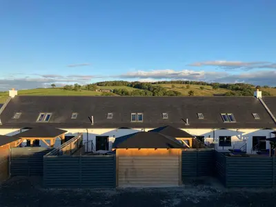 a view of a building with a roof at Westertonhill Holiday Lodges - Private Hot Tub Hire Available in Balloch