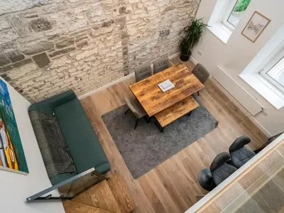 an overhead view of a living room with a wooden table and chairs at 2BD Loft Style Apt - Edinburgh - Free Parking - Pass the Keys in Edinburgh