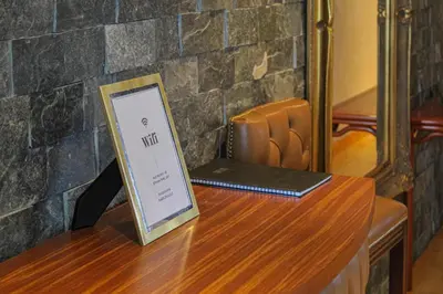 a wooden table with a sign on top of it at Deluxe Apartment in Lanark