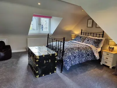 a bedroom with a bed and a window at Fabulous 2BD Maisonette Dunfermline, Fife in Dunfermline