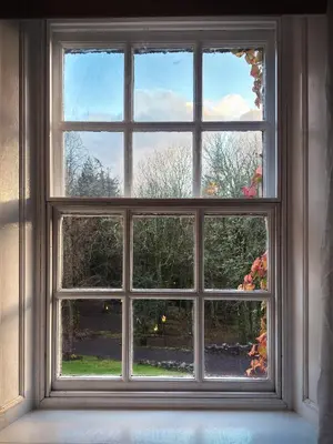 an open window with a view of a yard at Glencruitten House in Oban