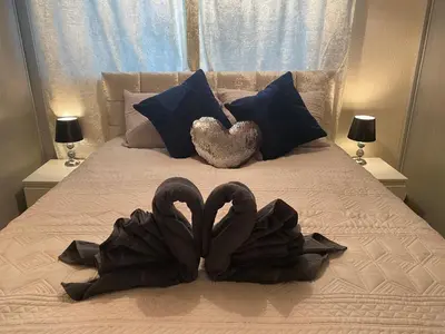 two swansrendered to look like hearts on a bed at Dunfermline, 2 bedroom home free on street parking in Fife