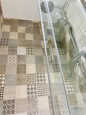 a shower stall with a checkered floor in a bathroom at DESIGNER HOUSE - University of Glasgow / Central Glasgow 'Hillhead' West End G12 - Luxurious & Contemporary Detached House / Terrace / Garden / 'electric car charging' Garage Parking in Glasgow