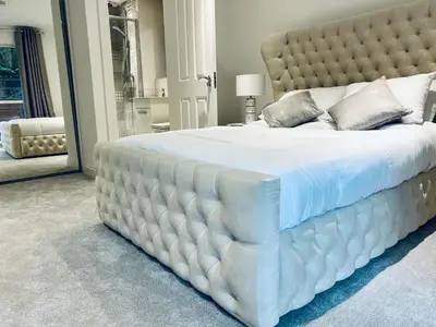 a large white bed with a tufted headboard in a bedroom at DESIGNER HOUSE - University of Glasgow / Central Glasgow 'Hillhead' West End G12 - Luxurious & Contemporary Detached House / Terrace / Garden / 'electric car charging' Garage Parking in Glasgow