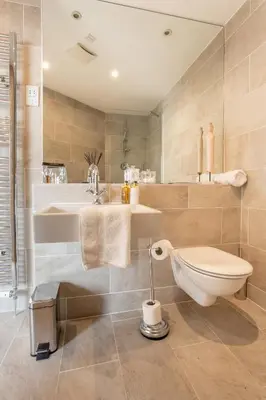 a bathroom with a toilet and a sink at Exclusive 2 Bed, Free Private Parking, in West End in Edinburgh