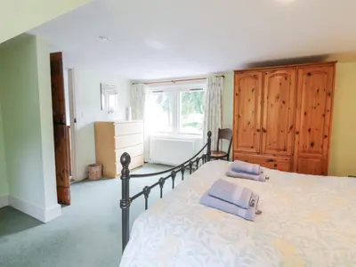 a bedroom with a bed with two pillows on it at Strathannan in Moffat